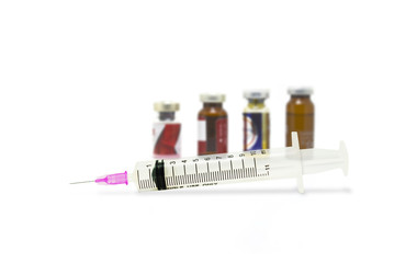 Medical syringe and dose bottles used in medicine. Medical part concept.