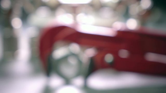 Red metalwork adjustable spanner for sanitary works against the background of Water shutoff and connecting shutoff valves for water supply
