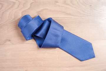 Men's accessories men's shoes, tie on a wooden background. Classic men's accessories. Top view