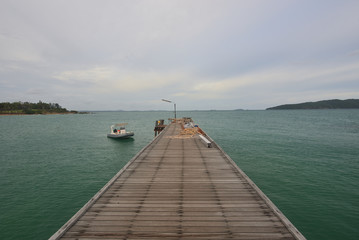 The harbor bridge extends into the sea