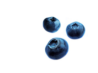 Small fruit of blueberries, moorland harvest isolated on white background. Vaccinium uliginosum (bog bilberry, bog blueberry, northern bilberry or western blueberry) soaring in the air