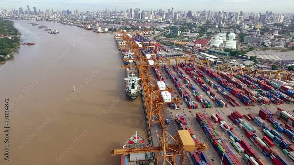 Poster aerial view above the bangkok dockyard by the chao phraya river with cargo ships waiting to be uploa