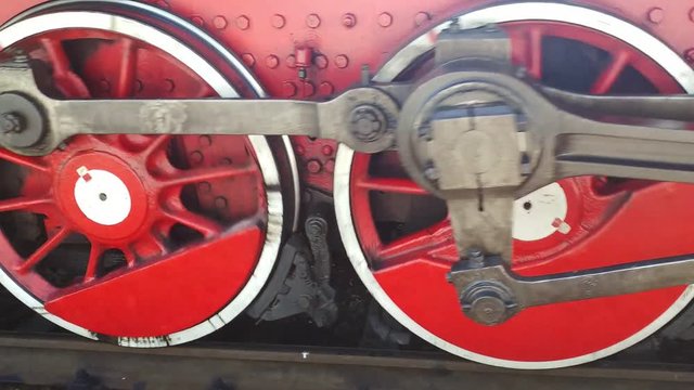 Wheels of the steam locomotive starting to move