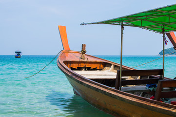 Naklejka na ściany i meble Long boat with engine and tropical beach, Andaman Sea, Thailand