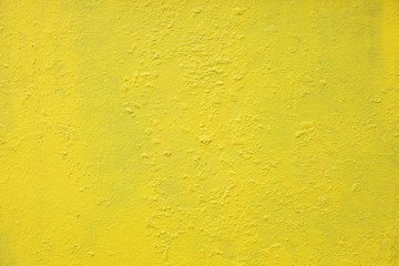 close up of yellow grunge wall texture