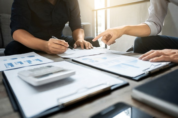 Business executives analyzing on valuation data paper