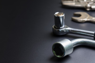Car repair tools on the black background.selective focus.