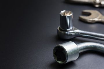 Car repair tools on the black background.selective focus.