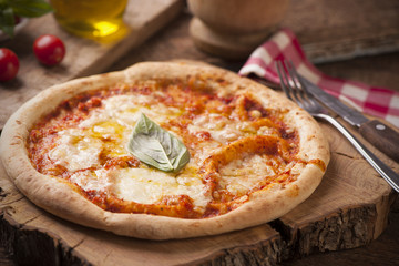 Pizza Margherita on wooden table