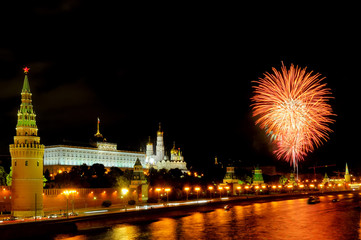 Fototapeta na wymiar Orange and white fireworks near Moscow Kremlin