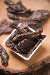 Beef Jerky on wooden background