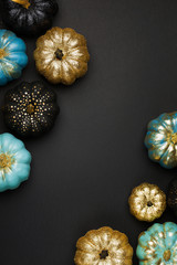 Stylish Halloween decorations. Shiny Decorative Pumpkins. Minimal creative stillife. Isolated