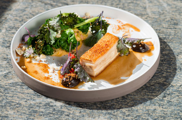 Plated freshly grilled pork belly with vegetable
