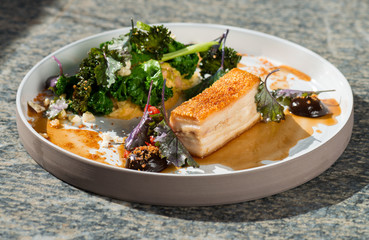 Plated freshly grilled pork belly with vegetable