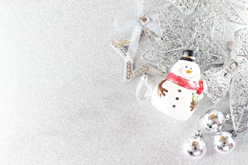 Happy New Year, Merry Christmas, celebration or holiday background concept : Santa Claus doll and shiny silver ornaments on bright background, Top view or flat lay with copy space
