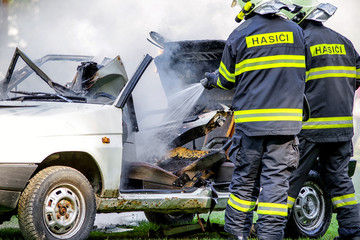 Fireman and burning car