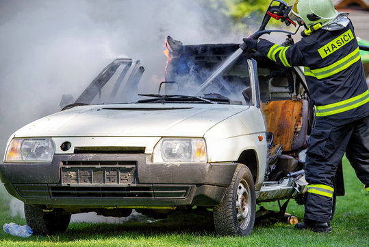 Fireman and burning car