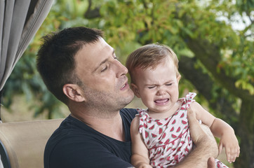 Father overwhelmed because his baby is crying