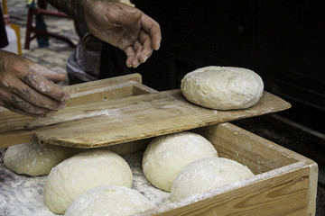 Bakers kneading bread dough in the traditional way