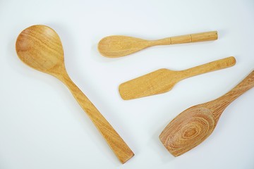 wooden spoons on white background,different wooden kitchen tools