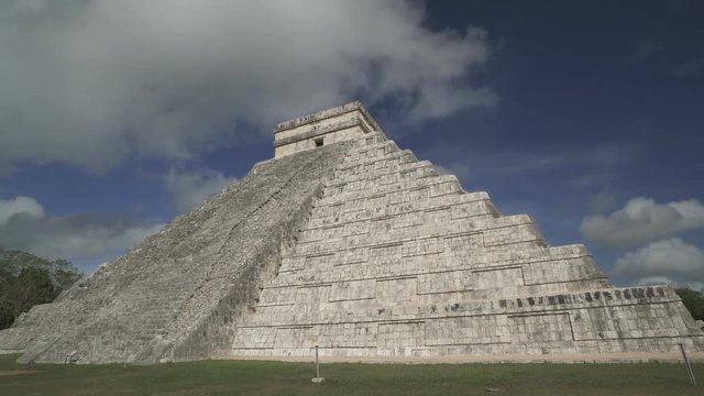 CHICHEN ITZA, MEXICO - MAY 25, 2017: Clouds are moving above huge Maya pyramid temple of Kukulkan in Mexico