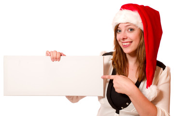 Attraktive Frau mit Nikolausmütze und Schild 