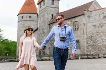 Fototapeta premium travel concept - two tourists in love walking in old town
