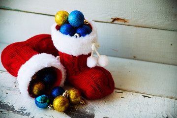 Christmas holiday background with Santa boots and decorations. Retro filter effect