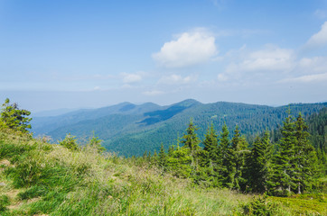 Travel, trekking, nature. Majestic, high green mountains. Horizontal frame