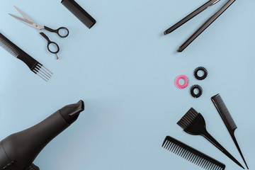 Hairdresser set with various accessories on blue background