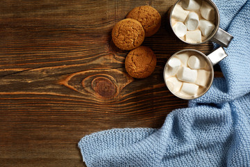Christmas drink. Mug hot coffee with marshmallow on the wooden background. New Year.