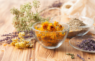 Calendula flowers at home recipes on the wooden table - obrazy, fototapety, plakaty