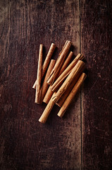 Cinnamon Sticks on a rustic wooden background