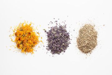 Dry calendula flowers,sage, wormwood on white