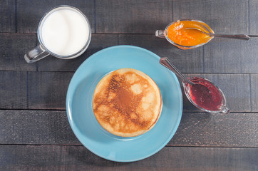 Small pancakes on a blue plate