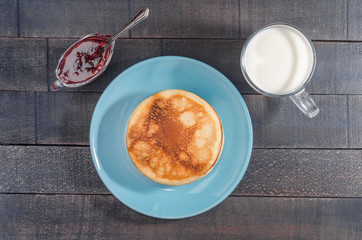 Small pancakes on a blue plate