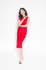 Glamour asian woman in stylish red party dress