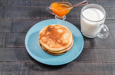 Small pancakes on a blue plate