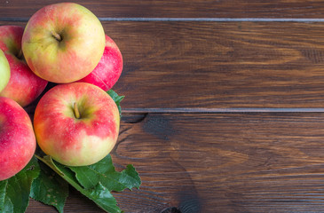 home grown apples on wooden table on the left