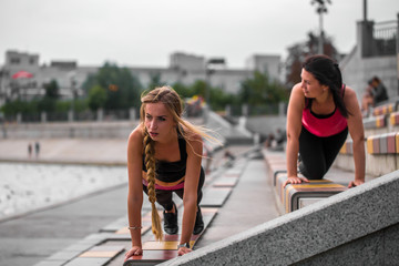 two sporty girls working together