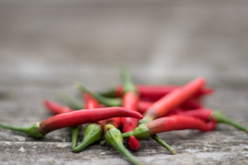 Hot Red Chilli Peppers on Textured Wood