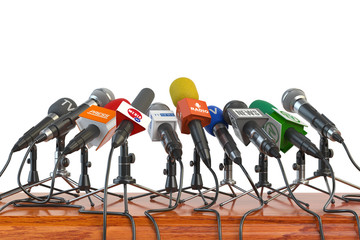 Microphones of different mass media, radio, tv and press prepared for conference meeting. Press conference or interview concept.