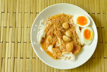 rice noodles with fish curry topping boiled creamy egg yolk