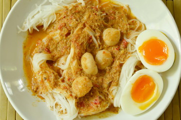 rice noodles with fish curry topping boiled creamy egg yolk