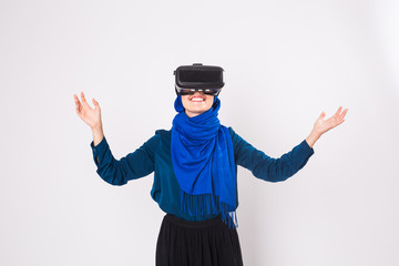 Young muslim woman with virtual reality glasses. Technology, vr, future and people concept