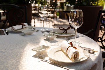 Served table in restaurant with dishes and glasses