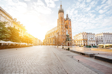 Fototapeta Cityscape view on the Market square with famous saint Marys Basilica during the sunrise in Krakow, Poland obraz