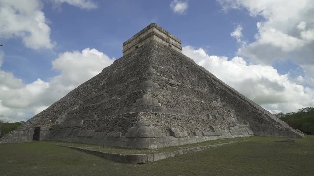 CHICHEN ITZA, MEXICO - MAY 25, 2017: Corner of Maya pyramid temple Kukulkan in peninsula Yucatan at sunny cloudy day