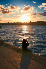 Fototapeta premium fisherman on a pier in the city