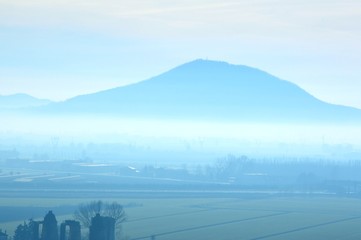 Hills in winter with fog